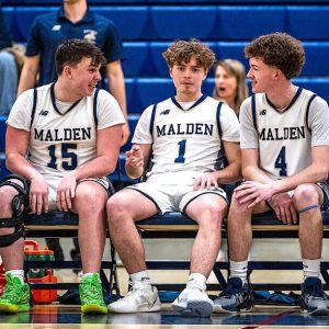 BENCH BREAK: From left, junior Kaua Fernandes Dias Valadares and seniors Aidan Brett, Jose Ferreira, Chris Macdonald and Wyatt Dessert take a quick break before beginning the second half against Somerville. (Advocate Photos/Henry Huang)