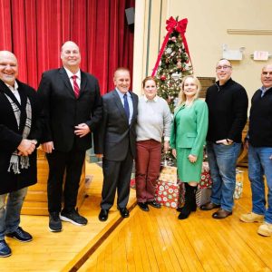 BOARD OF SELECTMEN AND ADMINISTRATIVE STAFF: Left to right, Selectman Jeffrey Cicolini, Town Manager Scott C. Crabtree, Selectman Michael Serino, Board of Selectmen Clerk Meredith Casagrande, Board of Selectmen Chair Debra Panetta, Selectman Frank Federico and Board of Selectmen Vice Chair Anthony Cogliano in front of the Christmas Tree in the second floor auditorium at Saugus Town Hall. They extend their best wishes to Saugus residents for a happy holiday season and New Year. (Saugus Advocate photo by Mark E. Vogler)