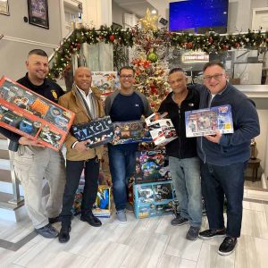 EVERETT - Ward 3 Councilor-Elect Anthony DiPierro and Rocco Longo of Sabatino/Mastrocola Insurance Agency generously contribute holiday toys to the Mass Badge Foundation’s Annual Toy Drive, aiding in spreading cheer to families in need. Pictured are Revere Police Sgt. Joe Internicola, Retired Boston Detective Marcelino Cardoso, Councilor-Elect DiPierro, Everett Police Officer Raoul Goncalves and Rocco Longo. Mass Badge will host their Annual Holiday Bash Toy Drive this Saturday, December 16, at Anthony’s of Malden.
