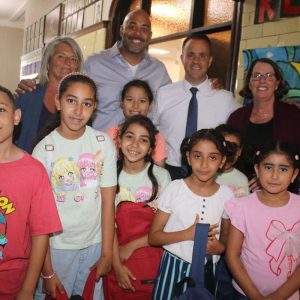 Beachmont School fourth-grader Aicha Ramzi, Garfield Elementary School third-grader Riham Ritaj, Beachmont School third-grader Malak Farrah and Beachmont School kindergartner Sajaja Farrah; in back, from left to right, are School Committee Vice-Chair Stacey Bronsdon-Rizzo, Amazon Community Engagement Head for New England Jerome Smith, Acting Mayor Patrick Keefe, Jr. and Superintendent of Schools Dr. Dianne Kelly.