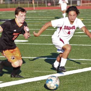 Saugus forward Alejandro Ortega tracked down a loose ball during a match last year against Beverly. (Advocate file photo)