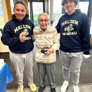 Philomena Nardone (center) is a Malden High School Class of 1946 graduate. Philomena, who is 95 years young, voted for Harry Truman in her first Presidential Election. She lives in the Monsignor Neagle Apartments on Charles Street and was voting at the Irish American Hall in Malden on Election Day. When she came to vote, she met Kyle Nickerson (left) and Jaylen Rivera-Fuentes (right), who are members of the 9th Grade Freshman Class of 2028 in their first year at Malden High School. Both students are members of the Malden High Baseball Team who were manning a snack table at the polling place. They all had a nice conversation about MHS – Past and Present. (Advocate Photo)