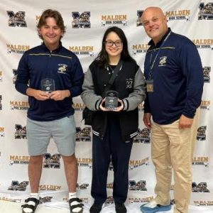 TOP SCHOLAR-ATHLETES: Bo Bogan Stead (left) and Hailey Tran (right) were greeted by Malde High School Principal Chris Mastrangelo (right) as they were recognized as the MHS Scholar-Athletes of the Year and were awarded $1,000 scholarships from the Golden Tornado Club, the booster club for Malden High athletics. (All Photos Courtesy Malden Public Schools/Athletics)