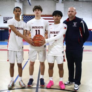 TEAM LEADERS: Patriots Captains Avi Lung, Ethan Day, and Josh Mercado with Head Varsity Coach David Leary are ready for the new season.  (Advocate photo by Tara Vocino)