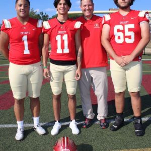 READY TO GO: Tide Head Coach Rob DiLoreto is shown with varsity quarterback Karmarri Ellerbe, wide receiver Giacobbe Ward and lineman Nick Raymond (from left to right) look forward to hosting Xaverian tonight at 7 pm. The three standout veterans are looking forward to their first win of the season.  (Advocate photo)