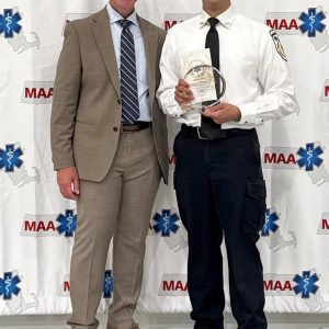 Cataldo Ambulance Paramedic Kathan Ramnath accepts Massachusetts Ambulance Association’s Circle of Excellence Award from MAA President Dennis Cataldo. (Courtesy photo)