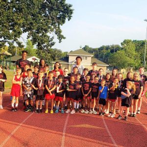 Celebrating the end of this year’s Saugus Sachems Track Camp are several dozen Saugus youth ranging from age five to 18. Holding the third place trophy from last Saturday’s track meet in Cranston, R.I., is six-year-old Phoenix Okoye. (Saugus Advocate photo by Mark E. Vogler)