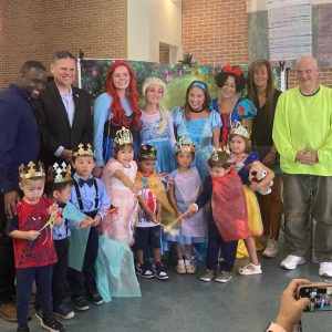 Senior Center Coordinator Mikeneil Paul (far left), Mayor Gary Christenson (second from left) and seniors and other participants at the Cinderella Birthday Celebration (Photo courtesy of the City of Malden)