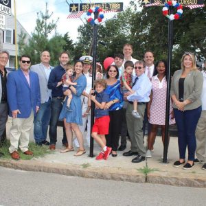 Shown from left to right: Back row: Revere School Committee member candidate Ralph DeCicco, Councillor-at-Large Anthony Zambuto, Ward 6 City Councillor Richard Serino, Veterans Service Office Director/Councillor-At-Large Marc Silvestri, granddaughter Allison Wayne, great-grandson Evan Wayne, 1, daughter Donna Farrell, grandson Paul Farrell, Jr. (CDR. USN Ret.), son-in-law Paul Farrell (CDR. USN Ret.), State Representative Jeffrey Turco, Acting Mayor Patrick Keefe, Jr., State Senator Lydia Edwards, State Representative Jessica Giannino, Northeast Metro Tech School Committee member/Revere School Committee member candidate Anthony Caggiano and Ward 2 City Councillor Joanne McKenna; front row: great-grandsons William Farrell, 8, and Lucas Wayne, 4, and great-granddaughter Lillian Farrell, 4.