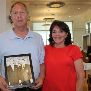 Ward 5 Councillor candidate Ronald and his wife, Marilyn Clark, hold a portrait of Alfred and Jack Satter, who were best friends in the 1960’s.