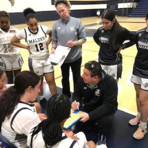 Coach Marino talks to team