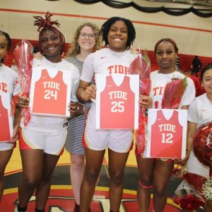 Shown from left to right: seniors Malica Guillaume and Taisha Alexandre, Head Coach Riley Dunn, seniors Kaesta Sandy, Malaica Guillaume and Gleidy Tejada during Tuesday’s Girls’ Varsity Basketball Senior Night at Everett High School against Somerville High School.