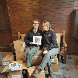 Collaborating on a children’s book: Ryan Duggan, of Saugus, and Nicki Pszenny, of Danvers – park rangers at Endicott Park – savored the moment last December when boxes of their book, “A Day at Endicott Park,” arrived. (Courtesy photo to The Saugus Advocate)