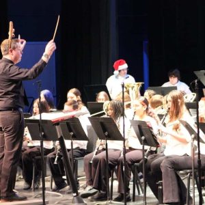 Conductor Justin Jones led a group of student band members during last week’s Middle School Concert. (Courtesy Photo of Dave Arwine, from the Band Parents Association.)