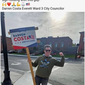 BESTIES: Shown is a picture from Tony “The Razer” Raymond’s Facebook page showing his candidate Darren Costa during a sign-holding event in Glendale Square.
