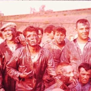 San Rock Festa Grease Pole circa late 1950s — MBTA tracks in the background — late MPD Commissioner Sal “Butch” Gennetti front and center (with full head of hair!) pleading for help from above, and birthday boy Dom Fermano (top right).