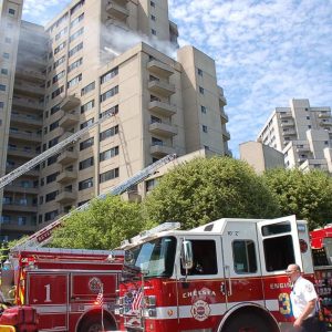 Firefighters are shown battling the high-rise blaze at 370 Ocean Ave. on June 21. (Advocate file photo)