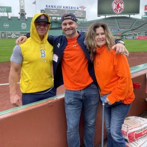 Saugus baseball legend Dario Pizzano is with former Red Sox and current Baltimore Orioles outfielder Tyler O’Neill and his mom Tracie at last year’s second annual MS4MS (Multiple Stadiums for Multiple Sclerosis) Spreading Orange game at Fenway Park. The Pizzano’s will be back at Fenway on June 14 for the Sox Spreading Orange game against the rival New York Yankees, which will raise money and awareness once again for this dreaded disease. Dario is currently the MS4MS Director of Fundraising.  (Courtesy photo)