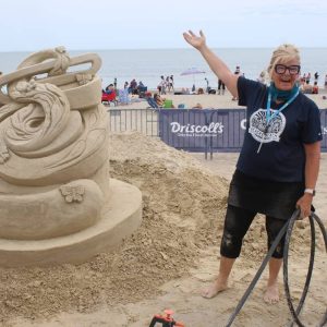 ANOTHER LOOK AT SAND ART: Saugus resident Deb Barrett-Cutulle worked on “A Butterfly’s Playground” at last month's 20th Annual Revere Beach International Sand Sculpting Festival. (Saugus Advocate Photo by Tara Vocino)