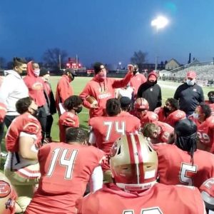 Rob DiLoreto is back as the head coach of the Everett High School football team after a two-year absence. DiLoreto was in charge of the Crimson Tide for three years, starting with the COVID year in 2020, when the football season was played in the spring of 2021 with no playoffs. DiLoreto’s teams went on to make the postseason the next two seasons, before he was unceremoniously let go. In this photo, DiLoreto is talking to the team, while holding the game ball, after the Tide defeated Lynn English, 42-12 to open up the 2020 season in April 2021. It was his first victory as the Tide’s head coach. Josaiah Stewart was DiLoreto’s defensive end on that team, but since then he went on to have a stellar collegiate career at the University of Michigan, where he played a pivotal role in the team’s 2024 run to the national championship. Stewart was drafted by the LA Rams in April and is now getting ready to begin his rookie season in the National Football League. (Courtesy photo / Everett Public Schools Facebook page)