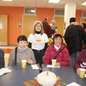 Shown from left to right: Anson Kwong, Yi Law, Bread of Life Executive Director Gabriella Snyder Stelmack, Thai Lo and Tsang Li.