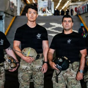 From left, Hospital Corpsman 1st Class Steve Kapala, Lt. Cmdr. Jesse Wang, Chief Hospital Corpsman Vlad Link, and Senior Chief Hospital Corpsman Laddy Aldridge, the U.S. Navy dive medical team with Explosive Ordnance Disposal Group 1, pose for a group photo ahead of Artemis II recovery operations while underway on Amphibious transport dock ship USS John P. Murtha (LPD 26) in the Pacific Ocean, April 9, 2026. John P. Murtha is underway in the U.S. 3rd Fleet area of operations supporting NASA’s Artemis II mission, retrieving the crew and spacecraft following their return to Earth and splashdown in the Pacific Ocean. NASA’s Artemis II mission sent four astronauts on a flight around the moon in the Orion space capsule, marking the first time humans journeyed to deep space in over 50 years. (U.S. Navy photo by Mass Communication Specialist 2nd Class August Clawson)