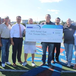 Shown from left to right: Police Chief David Callahan, Ward 2 City Councillor Ira Novoselsky, Acting Mayor Patrick Keefe, Jr., Head Coach Louis Cicatelli, donors Jamie and Lorenzo Russo, Councillor-at-Large/Veterans Service Department Director Marc Silvestri and Jennifer Keefe.