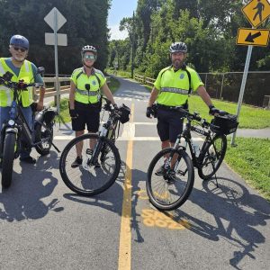 ENGAGING WITH THE POLICE: As part of his research and his commitment to help improve public safety on the town’s rail trail, Rick Fail (left) has made a point to reach out to Saugus Police Officers Alison Cooper and Billy Cash. (Saugus Advocate photo by Mark E. Vogler)