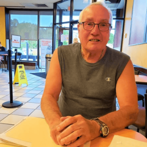 EYES ON THE EAGLE: Charlie “Zap” Zapolski in a local coffee shop during a June 2022 interview with The Saugus Advocate. He talked about his experience capturing the bald eagle on camera film. (Saugus Advocate file photo by Mark E. Vogler)