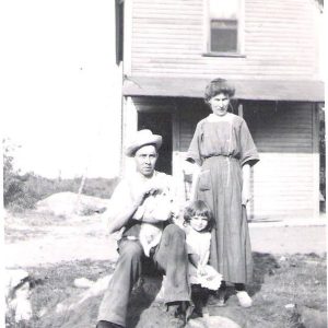 In the archive: Effie (Foley) and Harry Lake, Lake Street, Malden, 1920. “This picture is of my grandparents, whom I never got to meet [..] They were from Nova Scotia, Canada and arrived in Maine officially in 1908 (Effie) and 1909 (Harry) to be with family. My Dad was born in Malden in 1911 and by 1920 they bought the land and their house was built up in Maplewood Highlands, where they raised four children. The house here is the original and had additions put on later.” Shown are Harry F. Lake, Effie (Foley) Lake and daughter Evelyn.