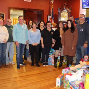 Medford-Malden Elks Lodge members with representatives from the Medford Family Network, Junior Aid Association of Malden, and Medford High School.