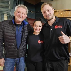 FAMILY TOGETHERNESS: Left to right: Anthony Kotkowski celebrates with his daughter-in-law Celina and son AJ after selectmen on Tuesday unanimously approved the couple’s request to operate a fast-food business at Square One Mall. (Saugus Advocate photo by Mark E. Vogler)