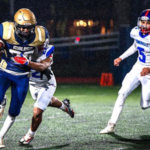 FELIX BUSTING FREE: Malden senior Felix Da Costa (26) breaks free from a tackle by Somerville’s Luis Rivas (21) and Jovanni Flores (5). (Advocate Photo/Henry Huang)