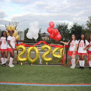 Seniors, shown from left to right: Emma Longmore, Stephany DeSouza, Malaica Guillaume, Taisha Alexandre, Isabella Barbosa, Laury Desir, Yasmin Linhares and Rosena Pun by the 2024 balloon.