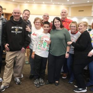 Frank DeCandia’s family members and others, shown from left to right: Mayor Gary Christenson, Pete Caso, best friend Jason Rossi, mother Marcie DeCandia, nephew Dominic Herrera, father Frank DeCandia, sister Stephanie DeCandia, uncle Dana Brown, aunt Marie Brown, aunt Patty Bessette and family friend Donna Riley.