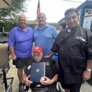 Felix Guiffrida, Marc Silvestri and Charlie Guiffrida congratulated Joseph Cody on his recognition.