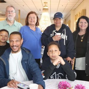 Shown from left to right: front row: Ferryway second grader Joshua Francois, Johnson Francois Sr. and Ferryway fourth grader Johnson Francois Jr.; back row: Ward 1 School Committee member Michael Drummey, Ward 1 Councillor Peg Crowe, mother Catherine Price and her friend, Mary Raftery.