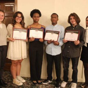 Field hockey Greater Boston League All Stars Stephany DeSouza, Malaica Guillame, Jonathan Scoletti and Cephas Orleus, shown with Head Coach Sabrina Wright, far right, and Assistant Coach Taylor Woodbury.