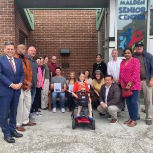 Family, friends and Disability Commission Members along with Mayor Gary Christenson (far left), City Council President/Ward 6 Councillor Steve Winslow (far right), Councillor-at-Large Craig Spadafora (kneeling, third from right) (Courtesy Photo)