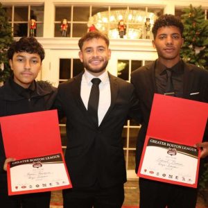 Everett High School boys soccer coach Rodney Landaverde presents junior Kevin Renderos, left, and senior captain Gabriel Garcia with their Greater Boston League all-star certificates during last week’s annual team banquet at Anthony’s in Malden.  (Courtesy photo)