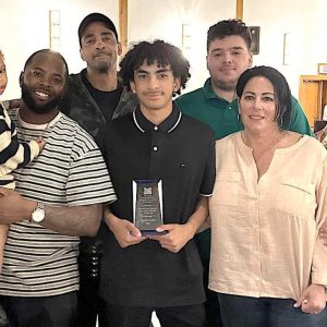 Davante Layne, Malden High baseball freshman, was the Greater Boston League Batting Champion with a .556 batting mark this past spring. Above, he is shown with his parents Tara and Ramon and other family members at the Malden High Baseball end-of-season dinner. (Courtesy/ Malden High School Athletics)