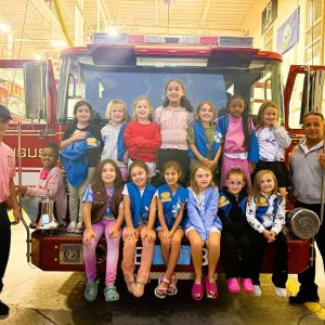GIRL SCOUTS VISIT FIRE DEPARTMENT: Saugus Fire Captain William E. Cross III and his son, firefighter Pat Cross, hosted members of Saugus Girl Scout Troop 63628 on Oct. 1 in observance of National Fire Prevention Month. The girls’ visit also put a focus on the start of Fire Prevention Week (Oct. 5-11) in Massachusetts. (Courtesy photo of Patty Montano)