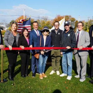 CUTTING THE RIBBON: Shown from left to right: Councillor-At-Large Robert Haas, State Rep. Jessica Giannino, Ward 5 Councillor Angela Guarino-Sawaya, Mayor Patrick Keefe, former State Rep. RoseLee Vincent, Department of Conservation & Recreation Commissioner Brian Arrigo, City Council Vice President Ira Novoselsky, Councillor-At-Large Anthony Zambuto and State Rep. Jeffrey Turco.