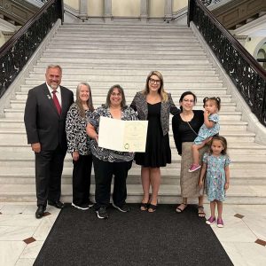 Shown from left to right: Ward 4 Councillor Paul Argenzio, his wife, Colleen, honoree Sallyann Vranos, State Representative Jessica Giannino, Mollie Cecconi and her daughters, who are Vranos’ students.