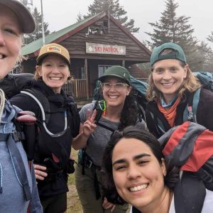 Sue Tufts is shown leading a group of hikers during a Wilderness Heals 2024 Mt. Crawford training hike.