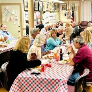 Guests enjoyed comradeship and an Italian dinner donated by the Castrabertis, owners of Prince Pizzeria. (Courtesy photo of Joanie Allbee)