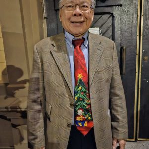 HIS HOLIDAY BEST: State Rep. Donald Wong (D-Saugus) wore a festive Christmas tie last Friday night as he stood near the entrance of Saugus Town Hall, waiting for the town’s Annual Tree Lighting and Festivities to begin. Wong said he plans to seek reelection to his Ninth Essex House District seat next year. (Saugus Advocate photo by Mark E. Vogler)