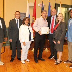 HONORED GUEST: Shown from left to right: Selectmen Jeffrey Cicolini, Michael Serino and Corinne Riley, Kowloon Restaurant Director Stanley Wong, Town Manager Scott Crabtree, Board of Selectmen Chairman Debra Panetta and Selectman Anthony Cogliano awarded a Town of Saugus Citation to Kowloon on celebrating their 75th anniversary during Tuesday’s selectmen’s meeting at Town Hall. (Saugus Advocate photo by Tara Vocino)