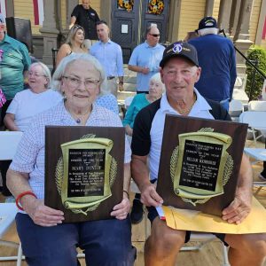 HONORED GUESTS: Mary Dunlop and William Boomhower displayed their “Person of the Year” Award plaques after a Founders Day ceremony in front of Town Hall last Saturday. (Saugus Advocate photo by Mark E. Vogler)