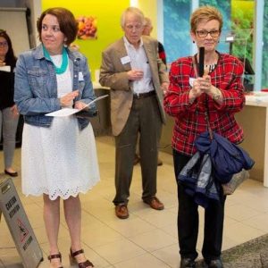 Mystic Valley Elder Services Board President Janice Houghton (right) introduces CEO Lisa Gurgone as host John Preotle of Preotle Lane & Associates looks on.